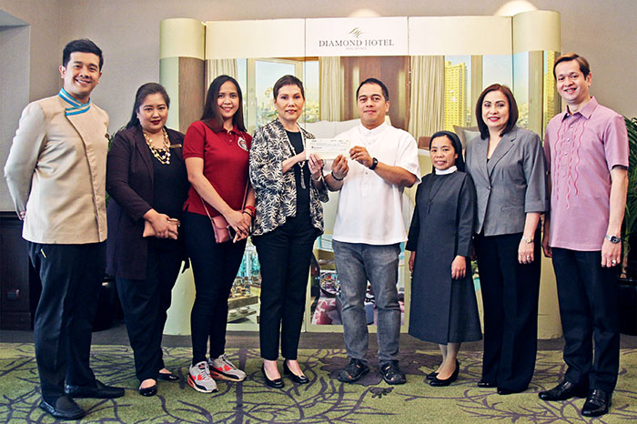 In the photo from left are: Mr. Christian Sanchez, Diamond Hotel Ugnayan Chairman; Ms. Melanie Pallorina, Diamond Hotel Public Relations Manager; Ms. Archie Prado, Kanlungan ni Maria Secretary; Ms. Vanessa Ledesma-Suatengco, Diamond Hotel General Manager; Rev. Fr. Antonio Gerardo "Bong" Sanchez, Kanlungan ni Maria Head; Sr. Marivic Caliso, SHC, Kanlungan ni Maria OIC-Admin; Ms. Sunshine Robles, Diamond Hotel Director of Sales and Marketing; and Mr. Jeffrey dela Paz, Diamond Hotel Human Resources Manager.