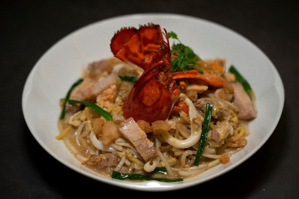 Chef Justin Quek's signature wok-fried Lobster Hokkien Mee 