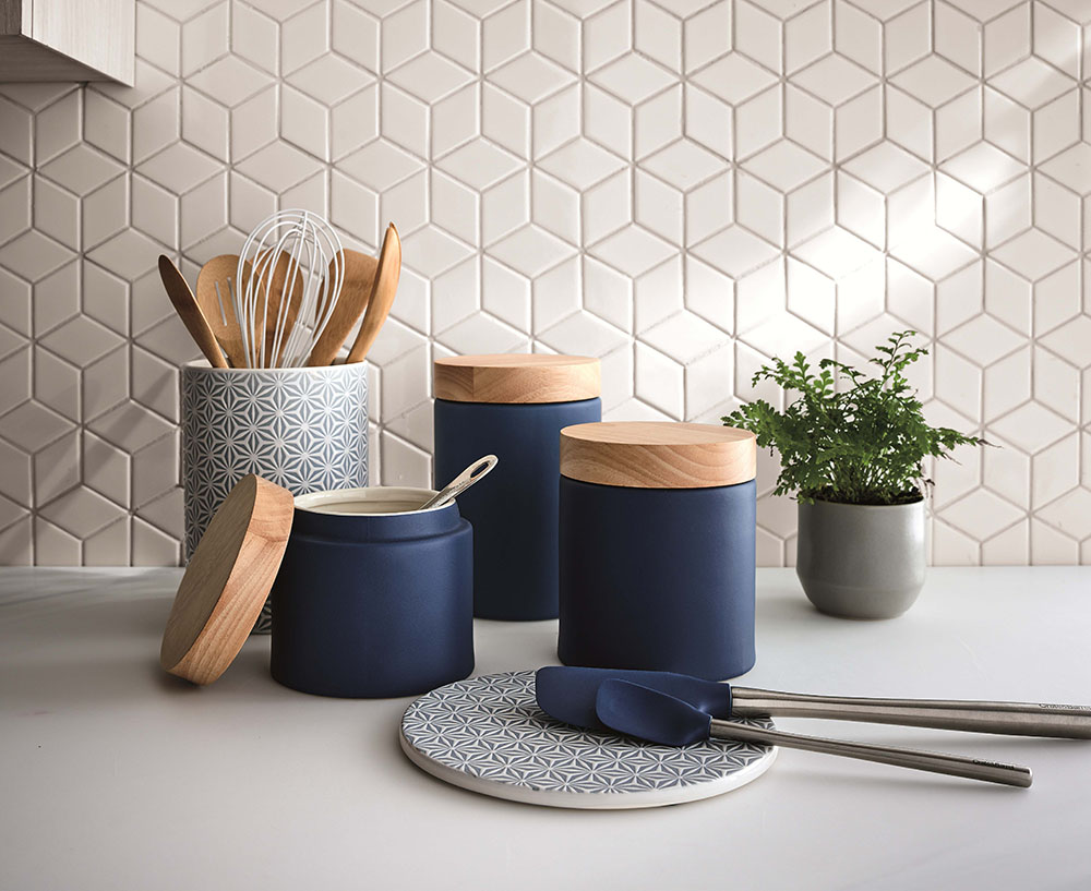 These cylindrical stoneware Niko Ceramic Canisters are beautifully simple, glazed in dusty blue and topped with a white oak lid. These enliven countertops with a fresh palette, clean lines and modern material mixing.