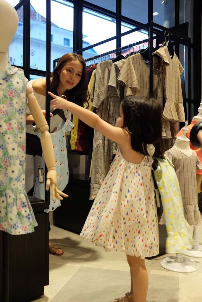 Andi and Olivia choose from a collection of adorable children’s clothing at their new favorite shop, Chubby Chubby, at Design Orchard.