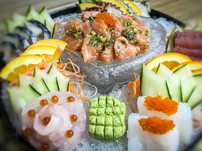 This ice-filled heart-shaped sashimi platter is filled with various morsels of succulent seafood. copy